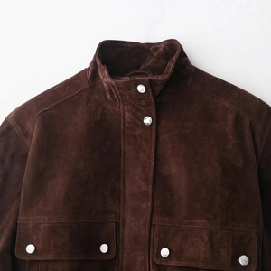 Deep brown suede jacket with high collar and silver snap buttons in a casual loose fit
