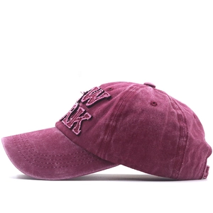 Detail view of New York 3D embroidery on wine red washed cotton vintage baseball cap