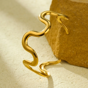 Polished 18K gold-plated stainless steel wave bangle with a unique minimalist open design