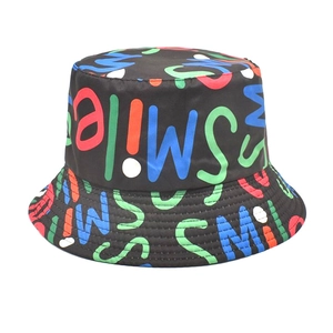 Close-up of black bucket hat featuring vibrant colorful graffiti SMILE text print