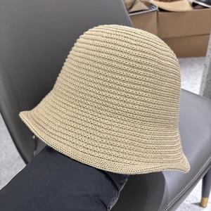 Detailed close-up of light khaki thin knit bucket hat showing breathable woven texture