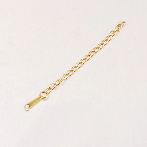 Detail of 6.5cm gold stainless steel extension chain for necklaces with a flat metal tag