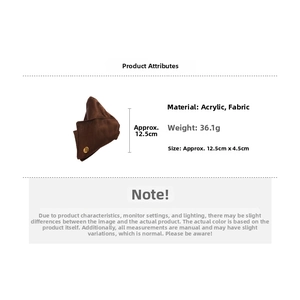 Detail of a dark brown satin fabric hair claw clip with acrylic base and 12.5cm size