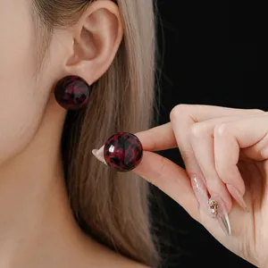Classic round leopard print stud earrings in dark red marble resin for women