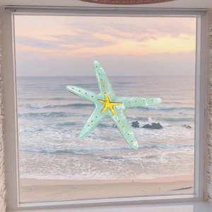 Mint green starfish hair clip with marble texture and golden accents over sea background
