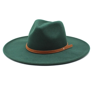 Detail view of dark green wool fedora with brown leather band and silver metal stud