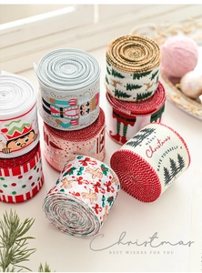 Detail of seven Christmas ribbons with nutcracker and cedar tree patterns for festive decor