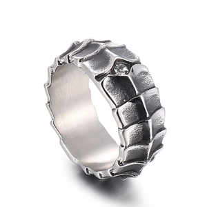 Rugged stainless steel dragon scale ring with antique finish and sparkling gemstone