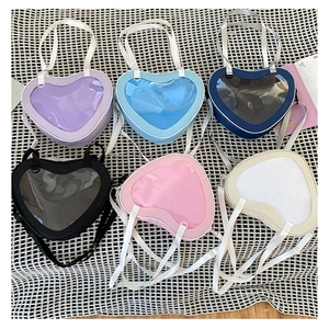 Heart-shaped ita bag collection with transparent window in six colors on checkered background