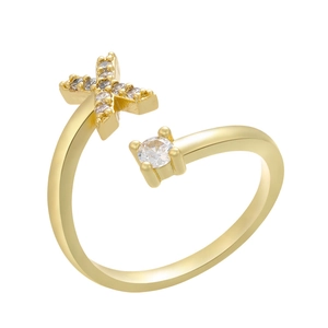 Detail of adjustable gold ring with pavé cubic zirconia X shape and round solitaire stone