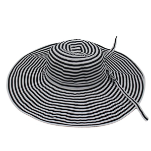 Detailed view of the wide brim and striped ribbon on this foldable summer sun hat