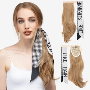 Detail of long wavy blonde ponytail extension with houndstooth silk scarf attachment