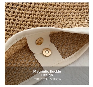 Detail shot of the magnetic snap closure and cream leather trim on woven tote bag