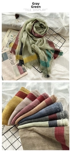 Detail view of lightweight plaid wool scarf in dusty green with morandi color palette