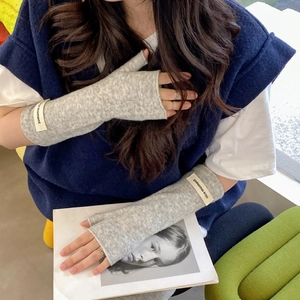 Gray knitted fingerless gloves for women with a nice moment label and cozy texture