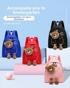 Detail view of colorful preschool backpacks featuring 3D plush bears and embroidery