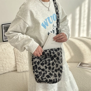 Detail of plush leopard print faux fur texture on this trendy large hobo bucket bag