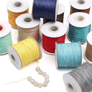 Multi-colored waxed thread rolls with decorative beads for DIY jewelry making