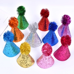 Assorted colorful glitter cone hats with pom-poms for pet birthday party decorations
