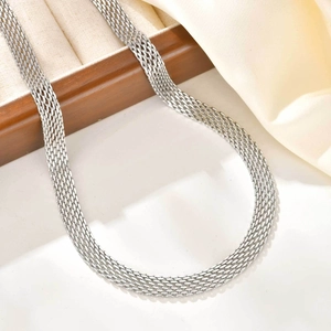 Detailed macro view of the silver stainless steel mesh chain necklace texture