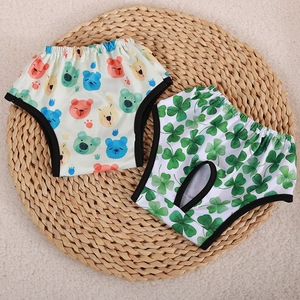 Breathable dog physiological pants with cartoon bear and clover prints on straw mat