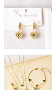 Detailed set of gold stainless steel heart jewelry featuring vibrant green gemstones
