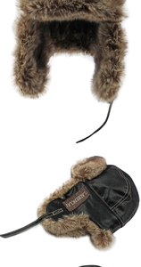 Nahaufnahme von schwarzem Leder und braunem Kunstfellfutter der Winter Uschanka Mütze