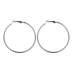 Detailed close-up of large polished silver hoop earrings with secure clasp closure