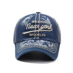 Vintage washed navy blue baseball cap with Brooklyn embroidery on a white background