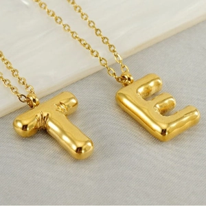 3D golden bubble initial pendant necklaces with letters T and E on stainless steel chain