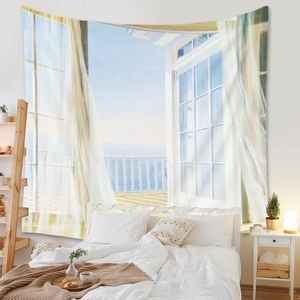 Detail of bohemian ocean view wall tapestry showing white lattice window and blue sea