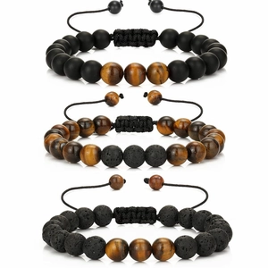 Detail of natural tiger eye and volcanic stone bead bracelets with adjustable cord