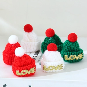 Mini Christmas knitted hats in red and green with plush pompom and LOVE lettering