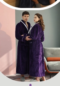 Detail of thick purple flannel bathrobe with white contrast piping and waffle texture