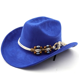 Royal blue western cowboy hat with bohemian shell and bead band on white background