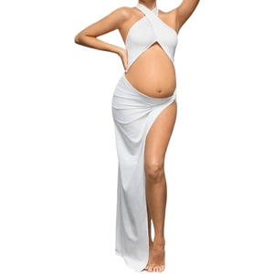 White halter maternity dress with cut-out belly and high slit for photoshoot