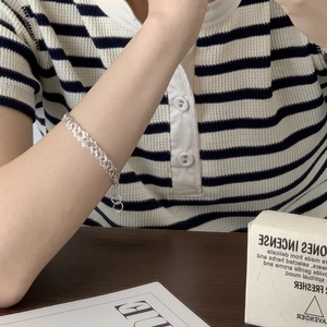 Close-up of S925 sterling silver multilayer chain bracelet worn on a model wrist