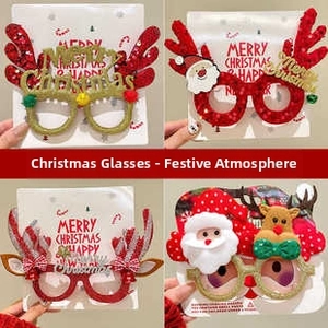Close-up of four festive Christmas glasses featuring glittery reindeer antlers and Santa designs