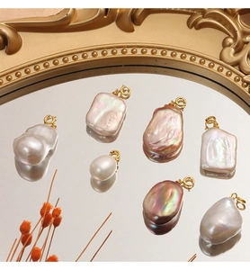 Detailed view of baroque freshwater pearls with S925 sterling silver gold plated clasps