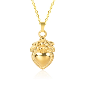 Macro shot of gold-plated 18k heart pendant with floral detailing and polished finish