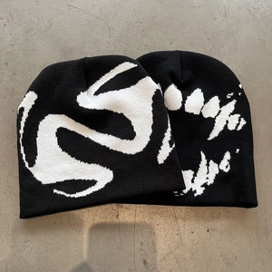 Streetwear knitted beanies in black and white jacquard pattern with retro aesthetic