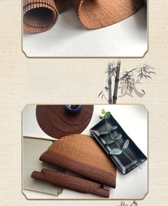Close-up of fine bamboo weaving texture and rolled-up brown oval tea mat for tea ceremonies