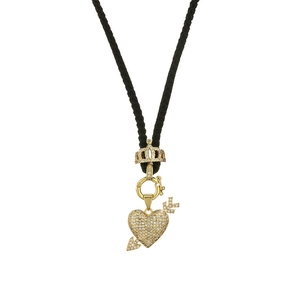 Gold-plated crown and heart pendant necklace with black woven cord on white background