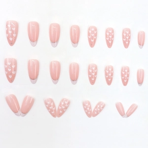 Sweet pink almond press-on nails with white hearts and silver glitter French tips set