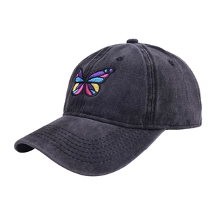 Detailed close-up of embroidered butterfly on vintage washed dark grey cotton baseball cap