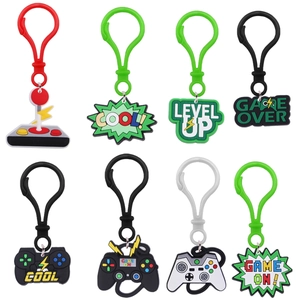Set of eight PVC game controller keychains featuring Level Up and Game Over text