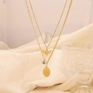 Double-layered gold necklace with angel charms, turquoise bead and pearl tassel details