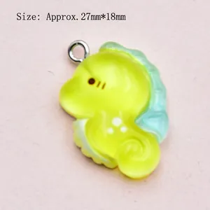 Detailed view of seahorse resin pendant with green gradient for DIY jewelry 27mm