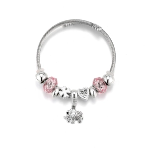 Detail of silver crown charm bracelet with pink faceted beads and elephant pendant