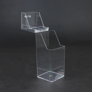 Detailed view of a clear acrylic lipstick organizer with a flip lid and multi-slot design